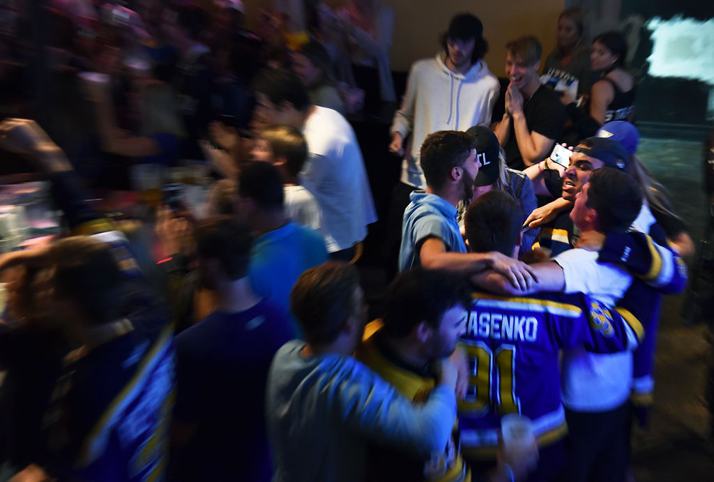 Blues fans huddled in celebration of the teams victory over the Bruins